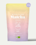 Bio Matcha Pulver 250 g Ceremonial von Health Bar im wiederverschließbaren, luftdichten Beutel mit pastellfarbenem Verlauf in Rosa, Gelb und Lila sowie 250 g Hinweis